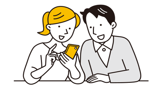夫婦がスマホで土地探しをしている様子